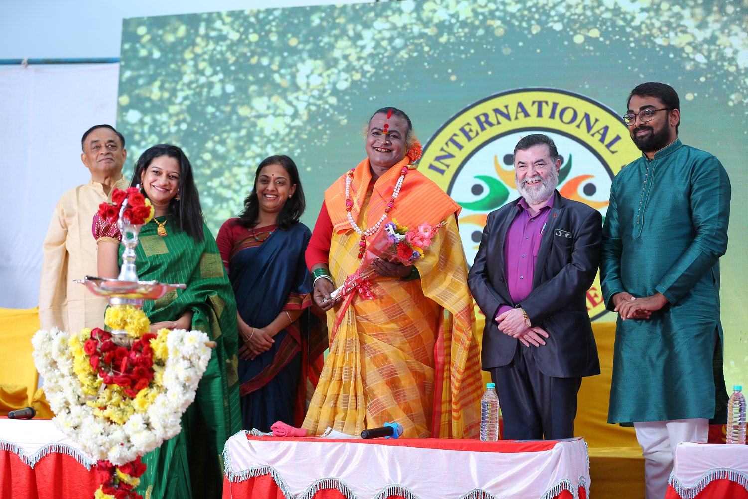 On the dais with the chief guest, under the school crest — Dr Varun Murthy